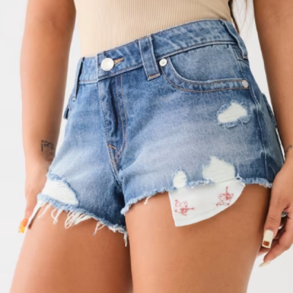 True Religion: 
DISTRESSED BUDDHA POCKET BOOTY SHORT